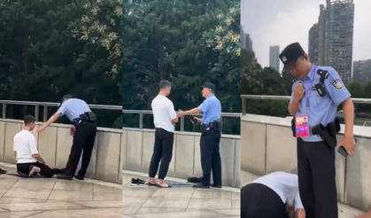 Çinli polis, namaz kılan genci engellemeye çalıştı!